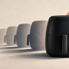 Air fryer sem marca em primeiro plano, com sombras de múltiplos aparelhos ao fundo, representando um nome que se torna categoria.